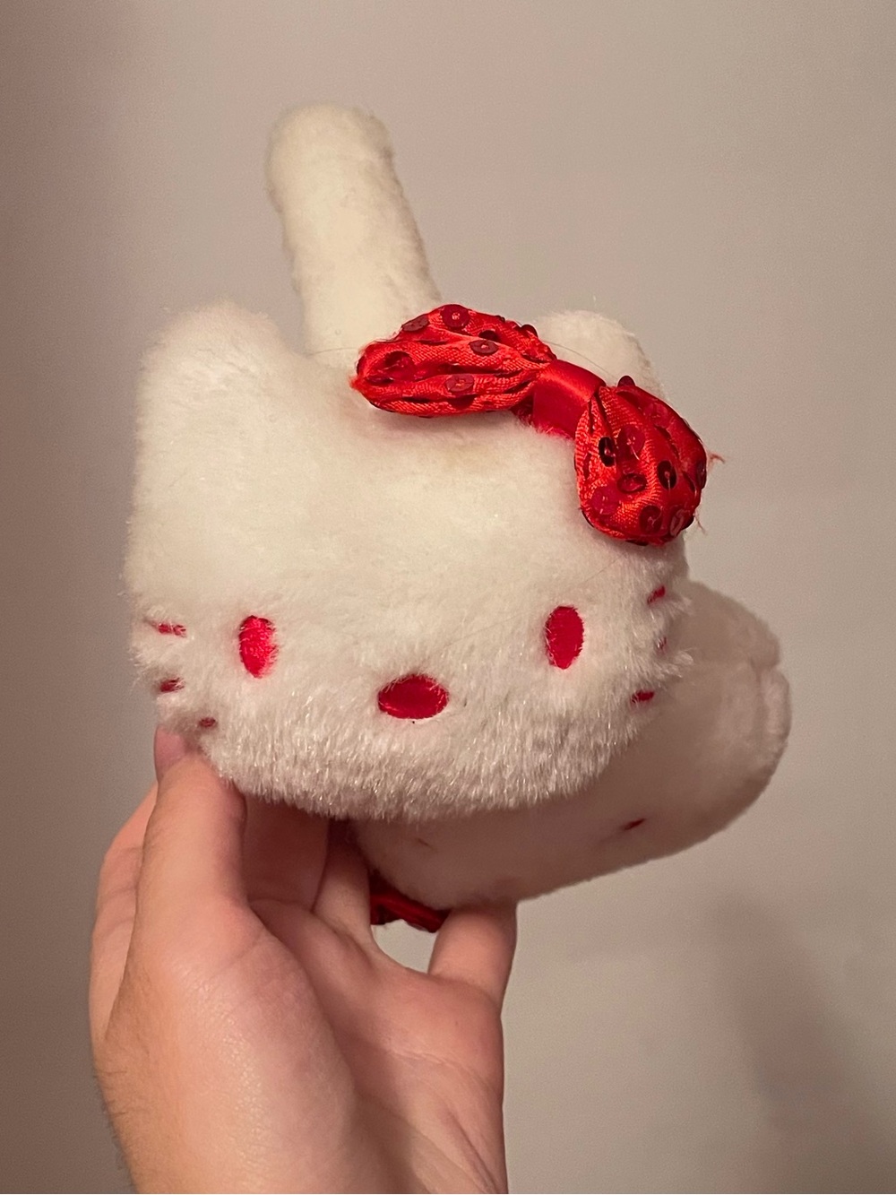 Hello Kitty vintage white earmuffs with red bow